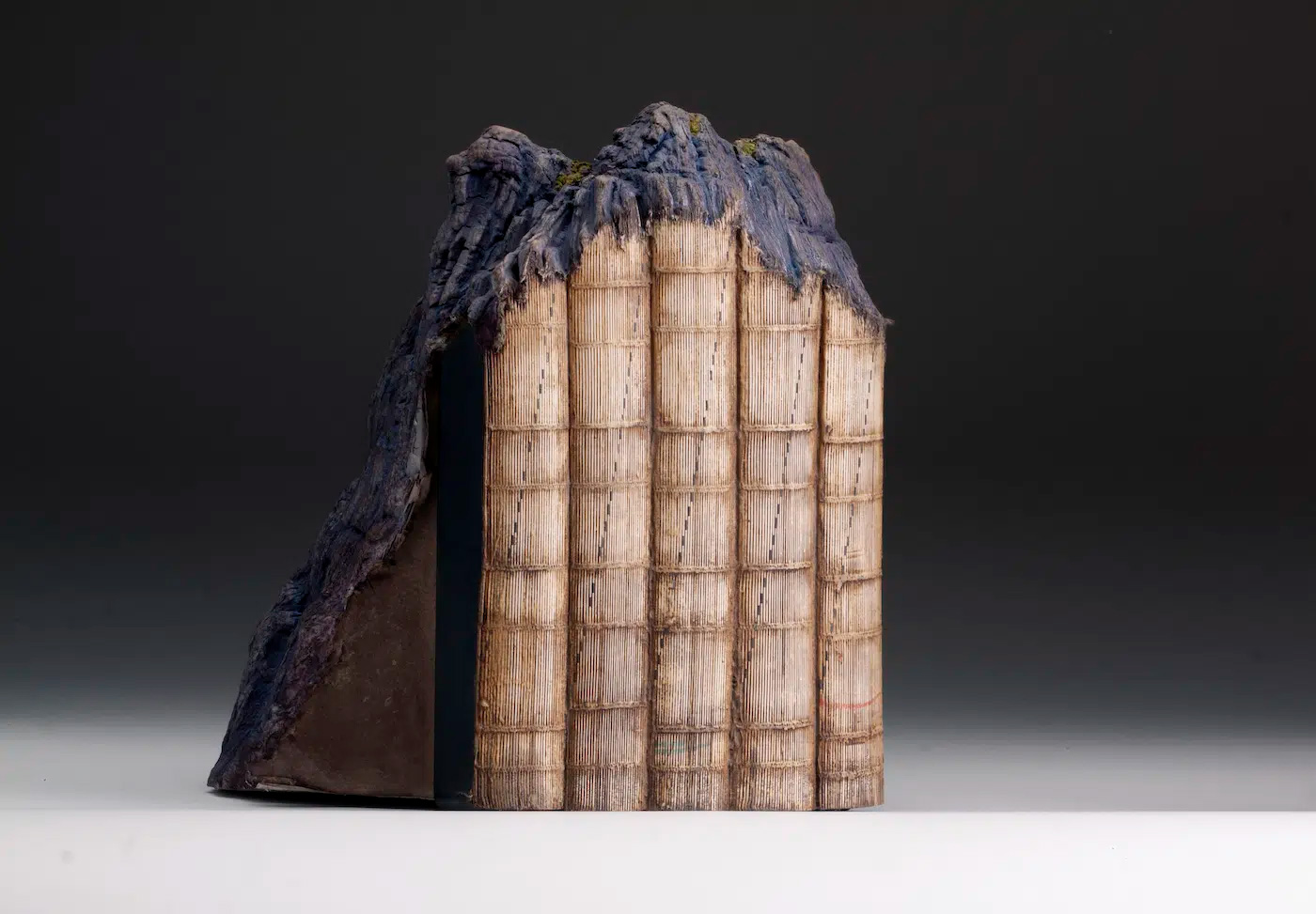 Artist Transforms Discarded Books Into Mini Mountainous Sculptures